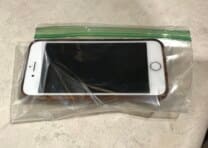 Put a phone in resealable plastic bag to make it waterproof