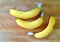 To keep bananas ripe longer, wrap the end of them in plastic wrap